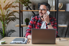 Guy smiling using phone