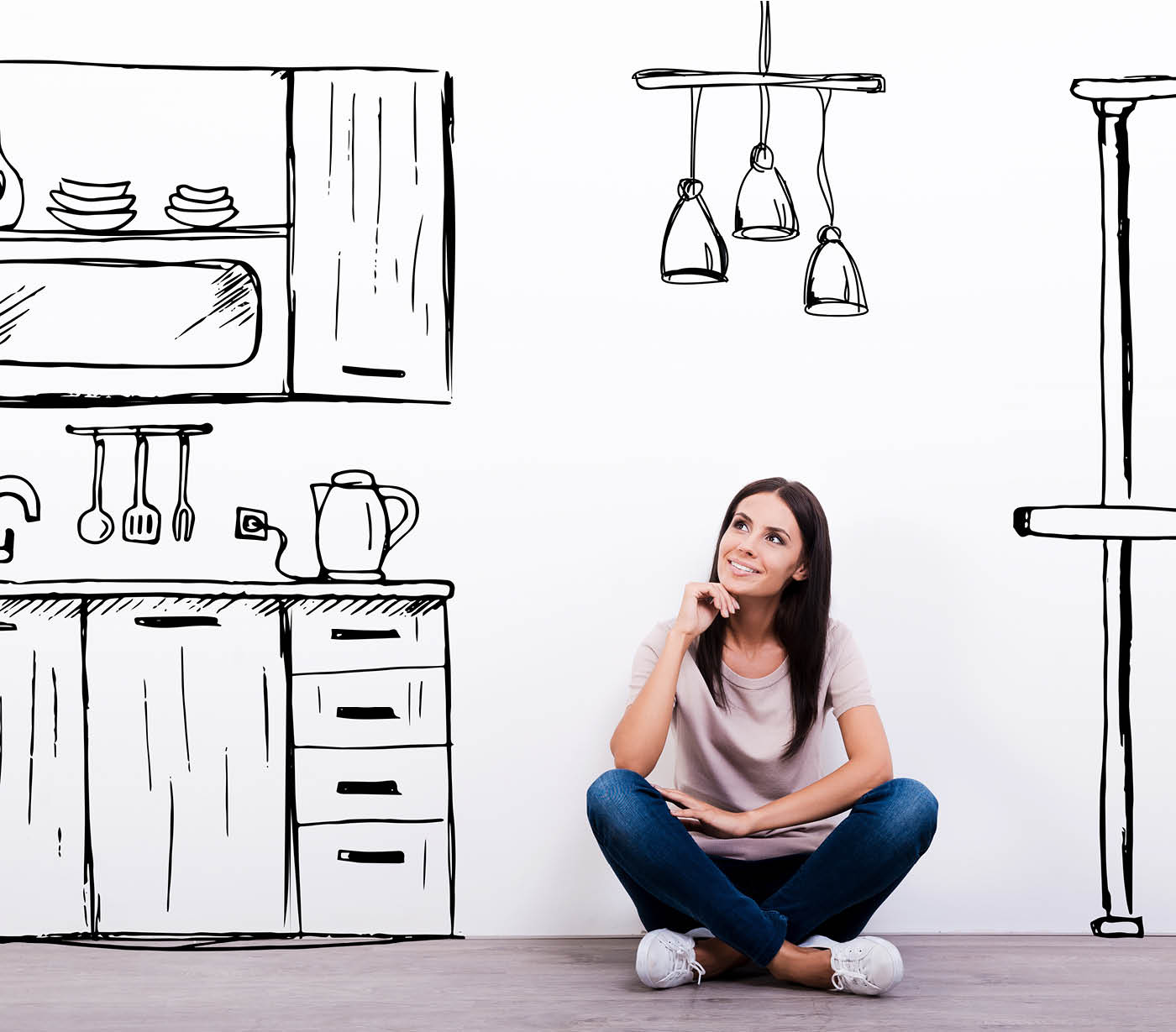 A woman sitting and thinking about her dream kitchen