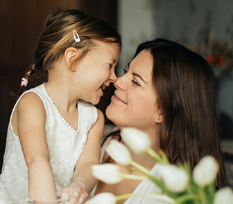 Mom and daughter laughing together